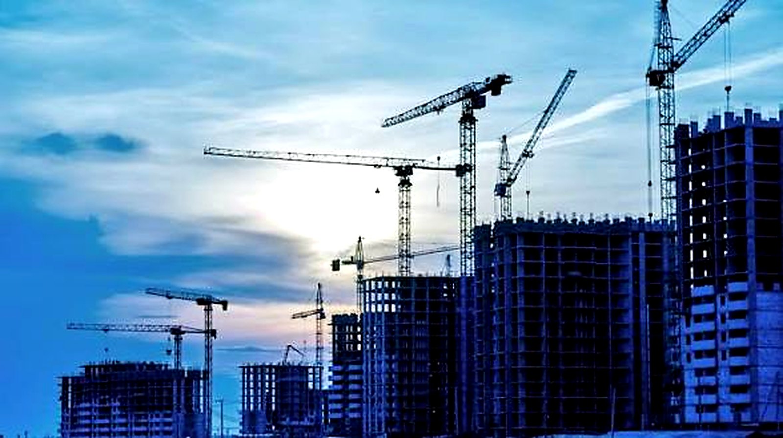 Ben-Prince Engineering construction skyline with cranes at dusk